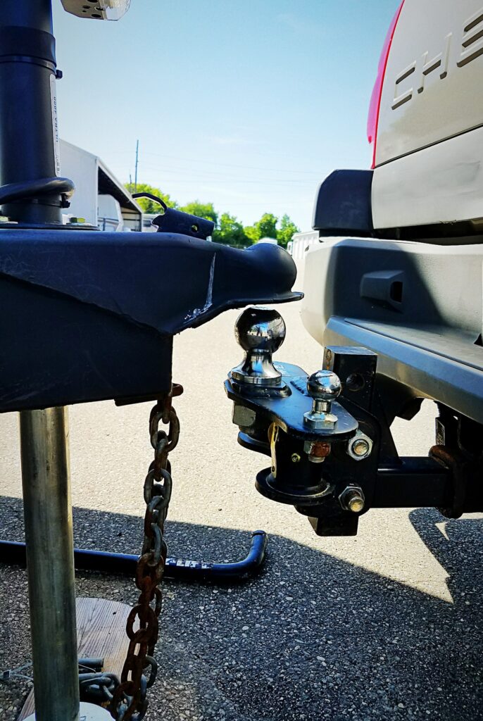 Trailer hitch lined up to lower to weight distribution tow ball